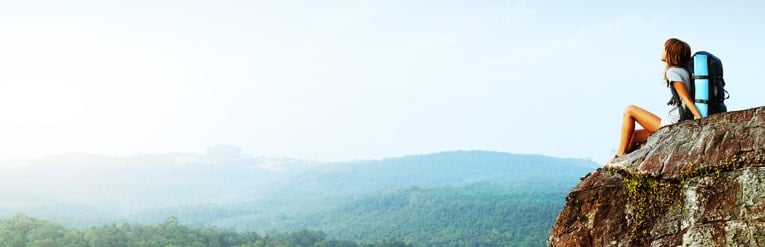 women sitting on mountain 