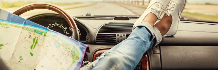 Girl with feet on dashboard 