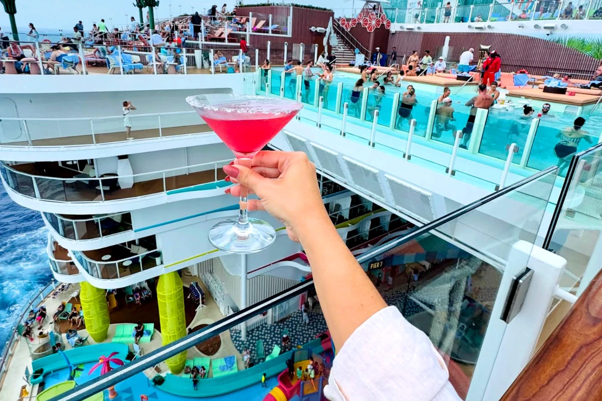 woman holding cocktail on cruise ship