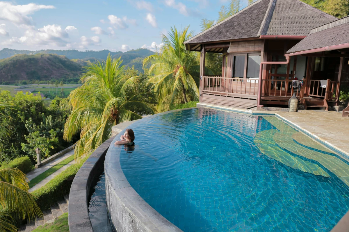 a woman in a pool in bali
