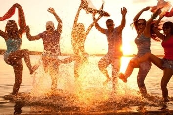 people jumping on the beach